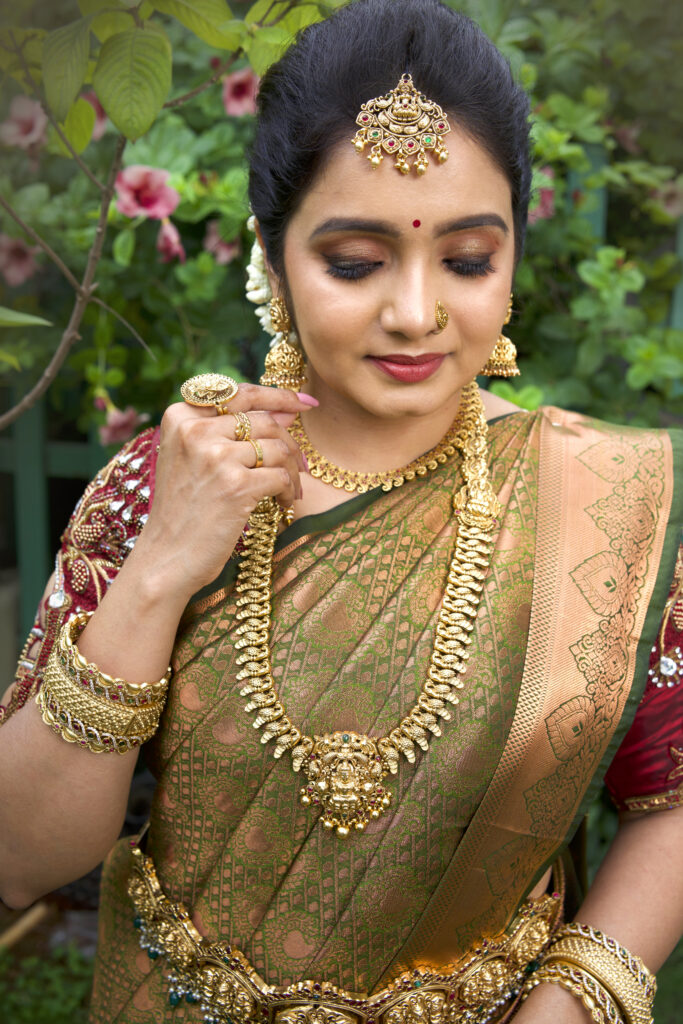 Bride with intricate gold jewelry and silk saree, styled by Lara Styles Unisex Salon Coimbatore