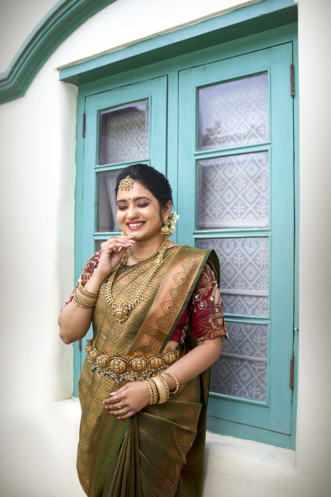 Bride with flawless makeup and gold accessories, styled at Lara Styles Salon Coimbatore