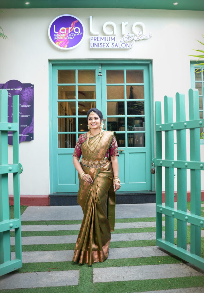 Bride in gold temple jewelry and elegant bridal saree, makeup by Lara Styles Salon Coimbatore