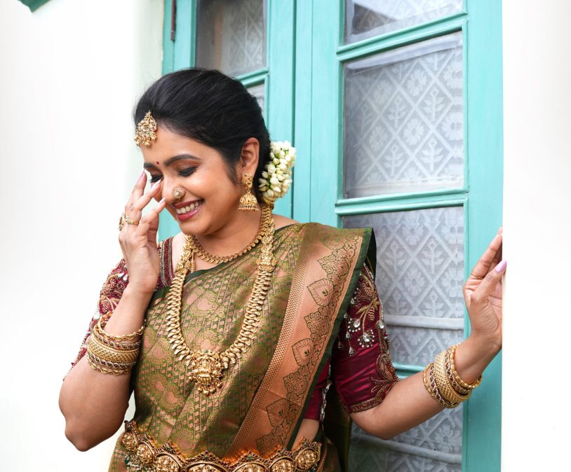 Bridal hairdo with floral accessories and makeup by Lara Styles Unisex Salon Coimbatore